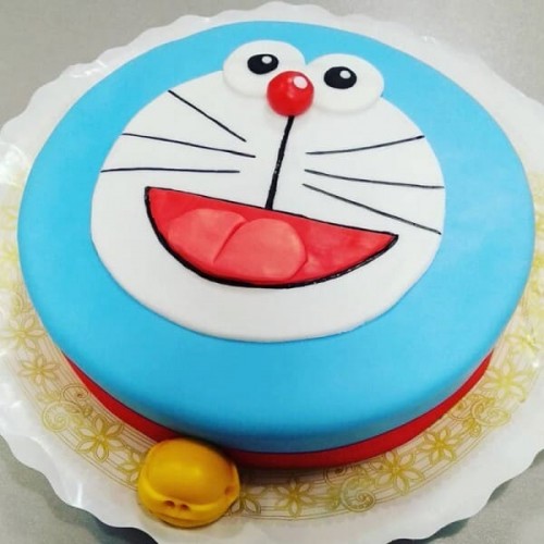 Cheering Doraemon Fondant Cake Delivery in Gurugram