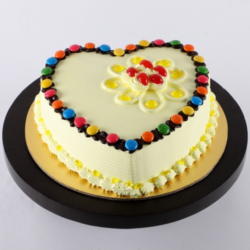 Heart Shaped Butterscotch Gems Cake Delivery in Gurugram