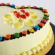 Heart Shaped Butterscotch Gems Cake Delivery in Gurugram