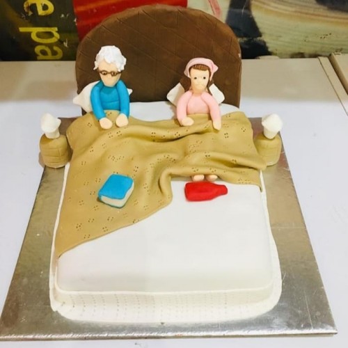 Old Parents in Bed Theme Cake Delivery in Gurugram
